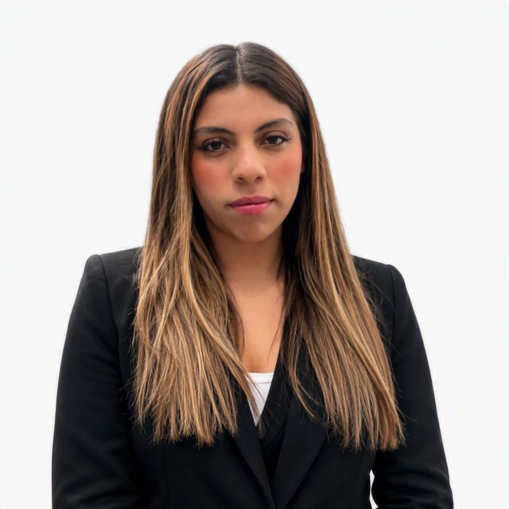 a person with long hair wearing a black suit