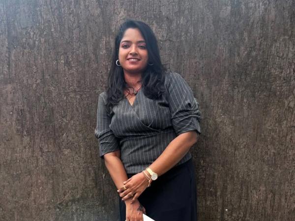 a person leaning against a wall