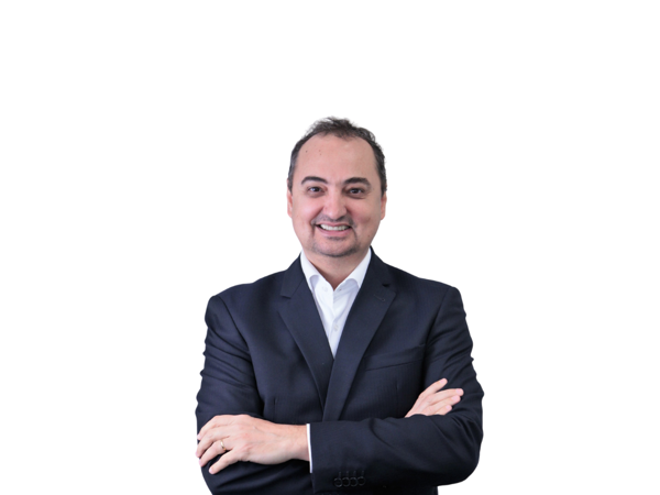 a person in a suit with his arms crossed