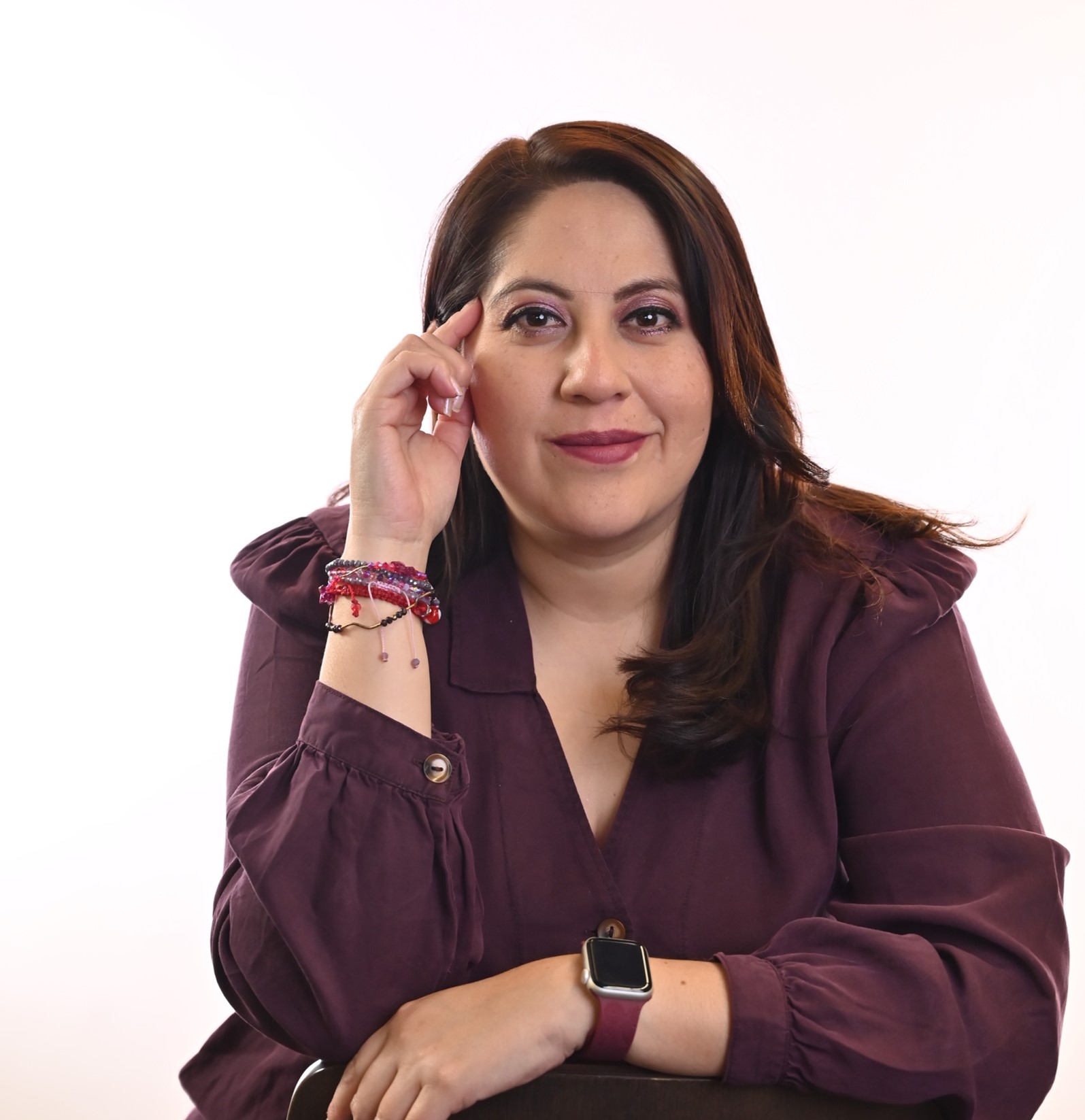 a person with her hand on her head