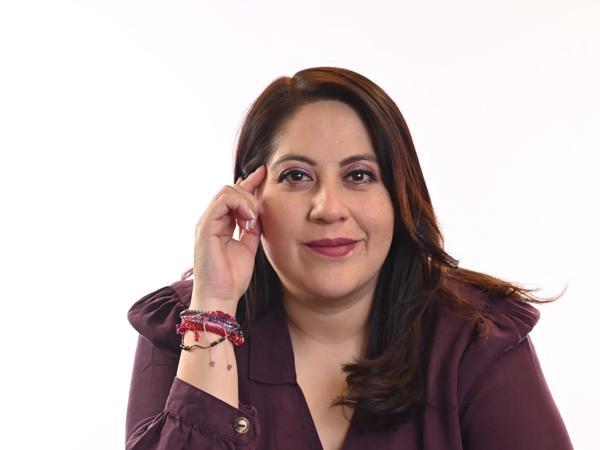 a person with her hand on her head