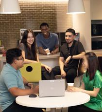 a group of people sitting around a table