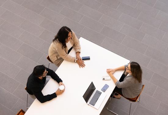a group of people sitting at a table