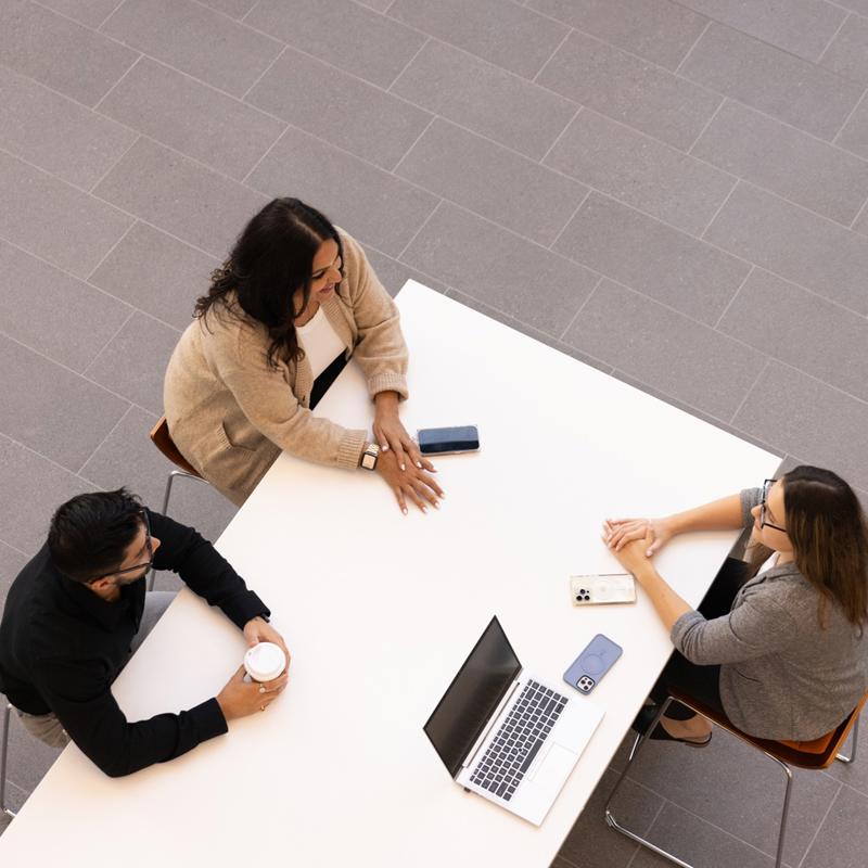 a group of people sitting at a table