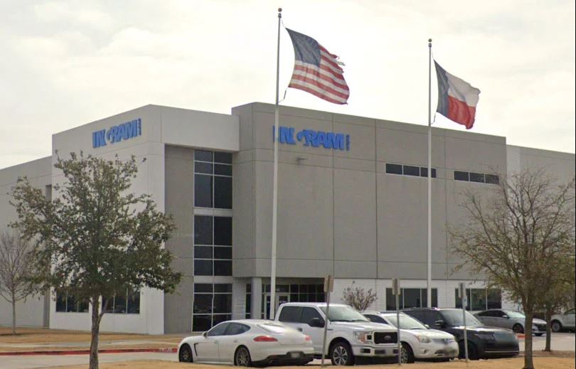 a building with flags in front of it