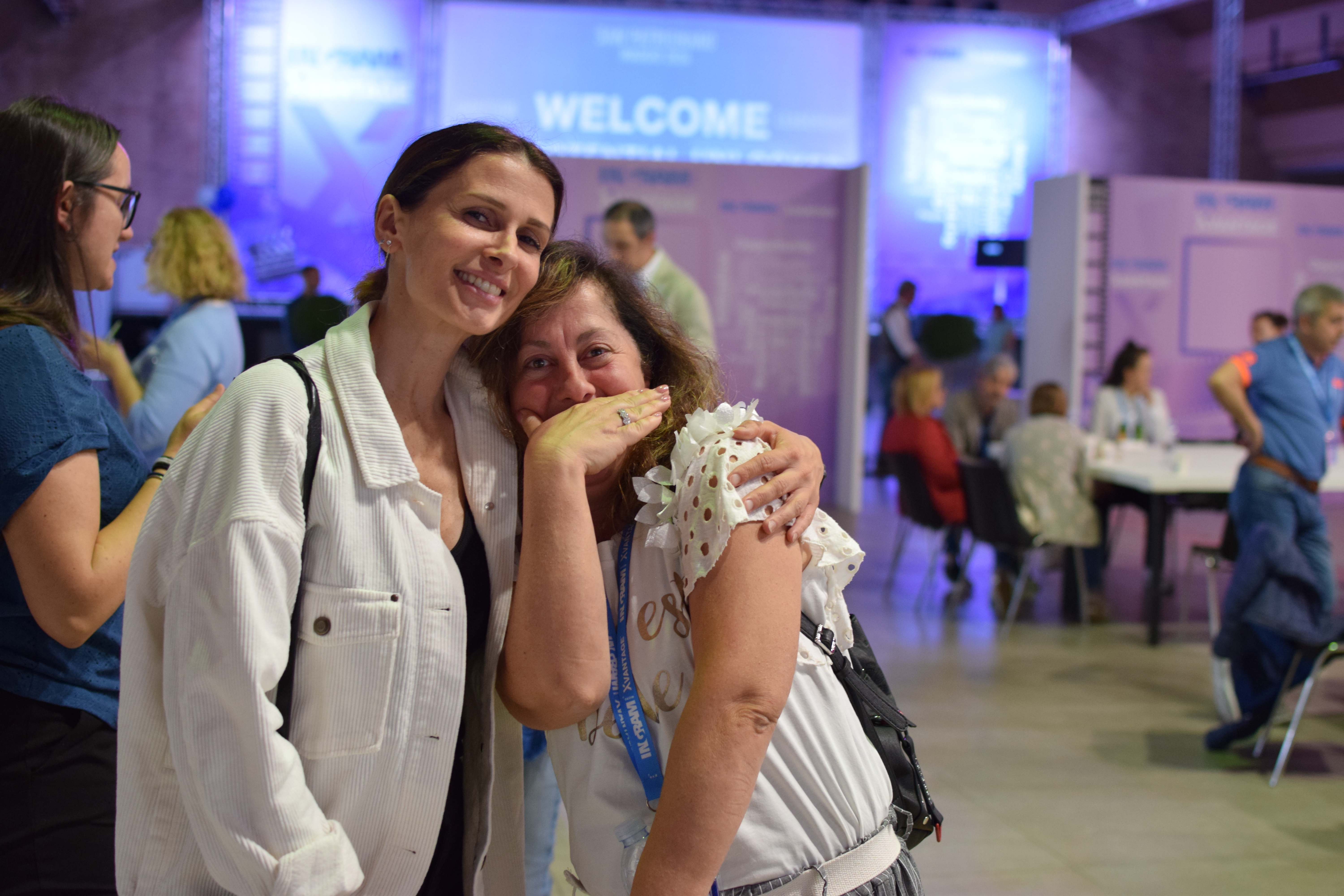 two women smiling at camera