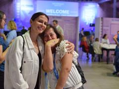 two women smiling at camera