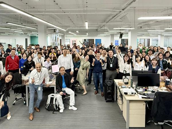 a large group of people in an office