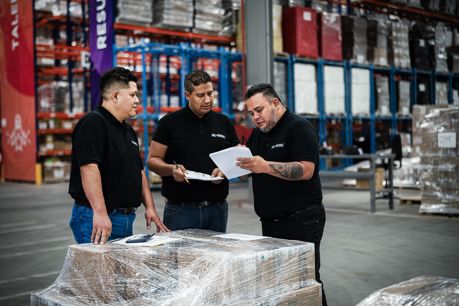 a group of men in a warehouse