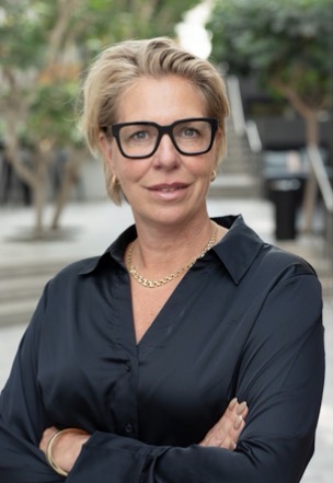 a person wearing glasses and a black shirt