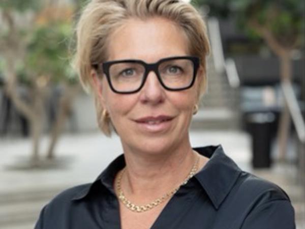 a person wearing glasses and a black shirt