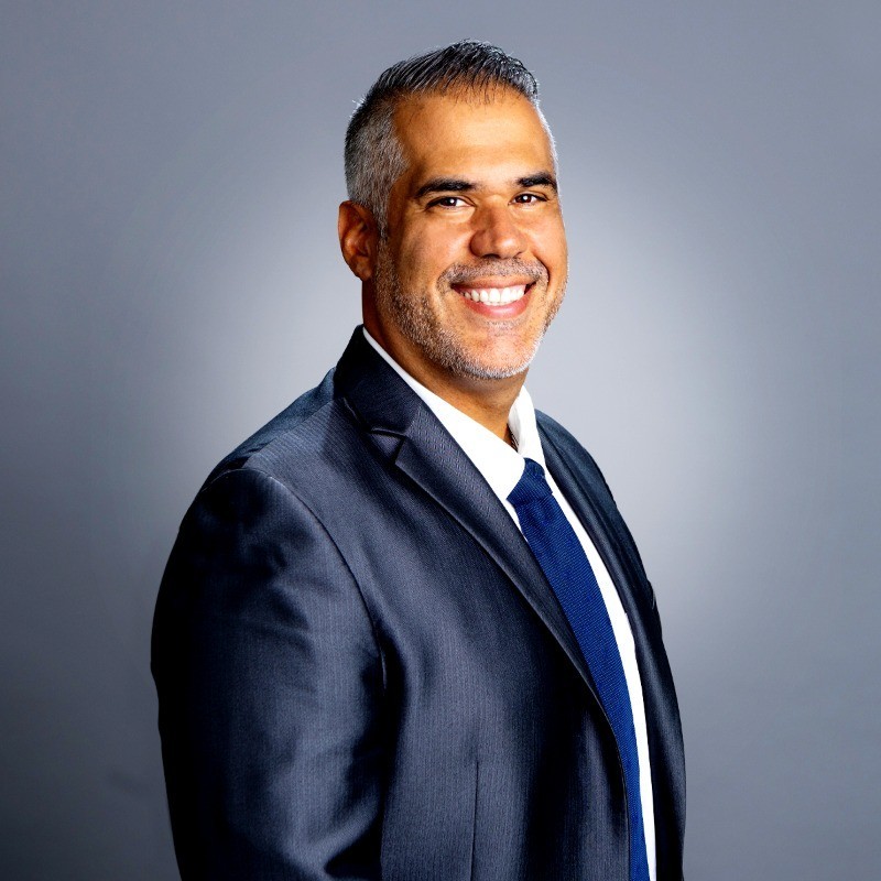 a person in a suit smiling