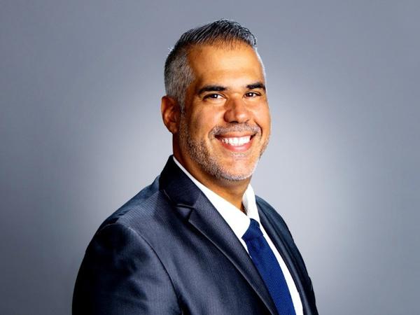 a person in a suit smiling