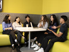 a group of people sitting around a table
