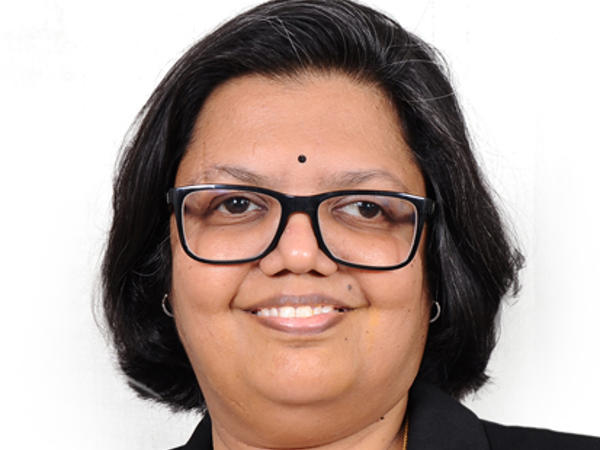 a person wearing glasses and a black jacket