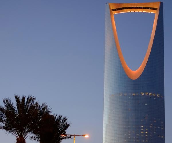 a tall building with a curved top