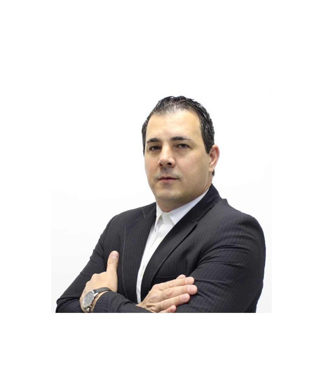 a person in a suit with his arms crossed