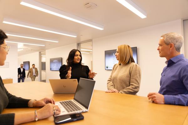 a group of people in a meeting