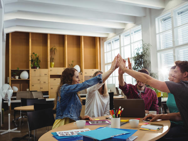 Creative Business Team Putting Hands Together