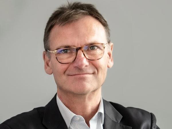 a person in a suit and glasses